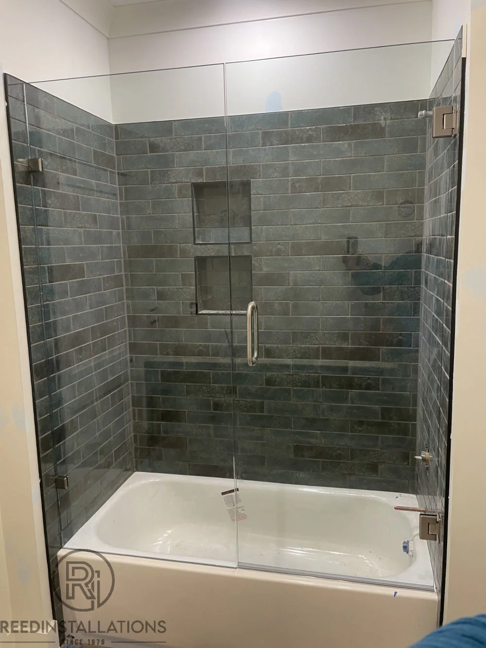 Reed Installations Bespoke Glass, Mirror, and Shower Door Solutions 