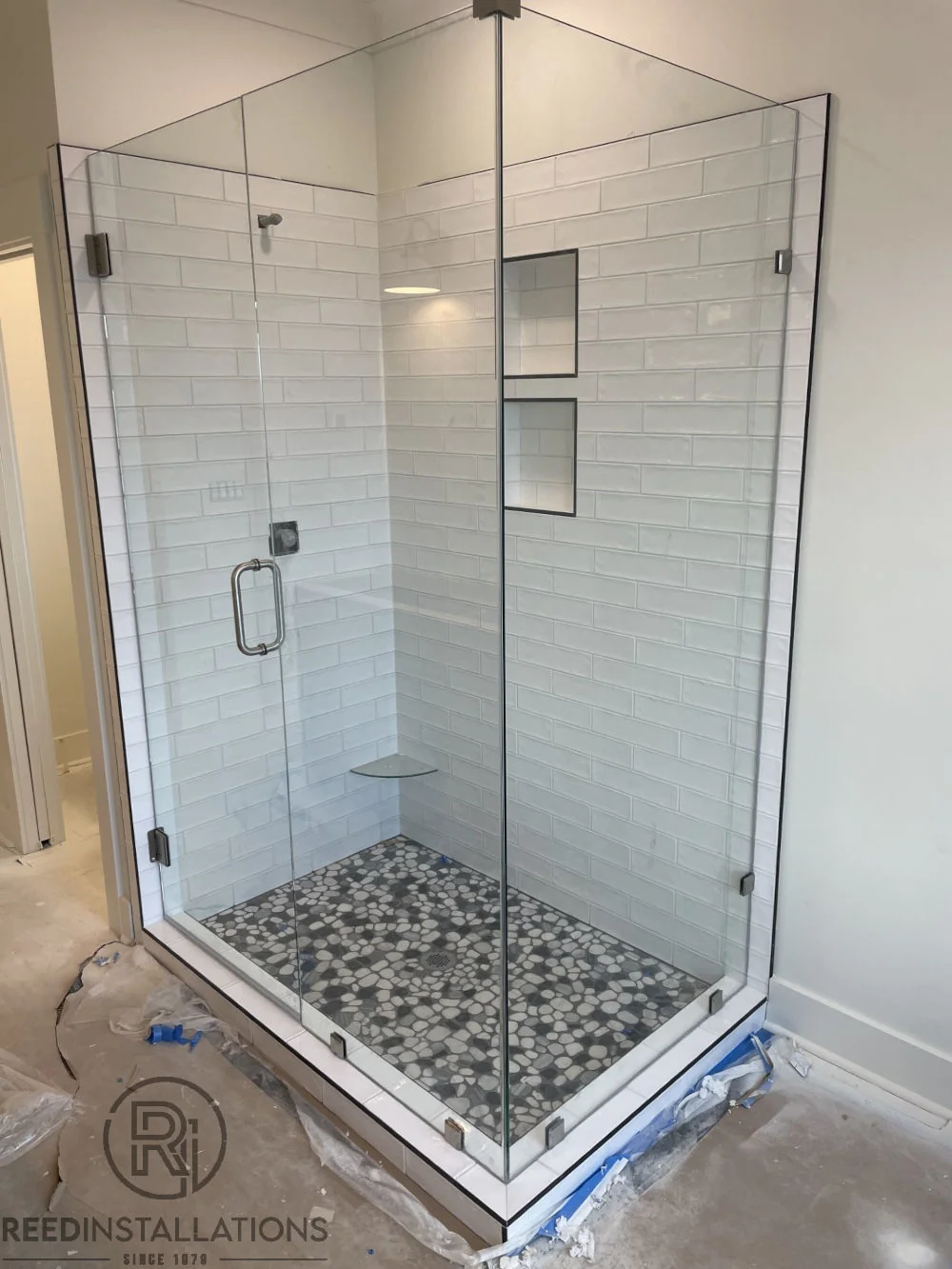 Reed Installations Bespoke Glass, Mirror, and Shower Door Solutions 