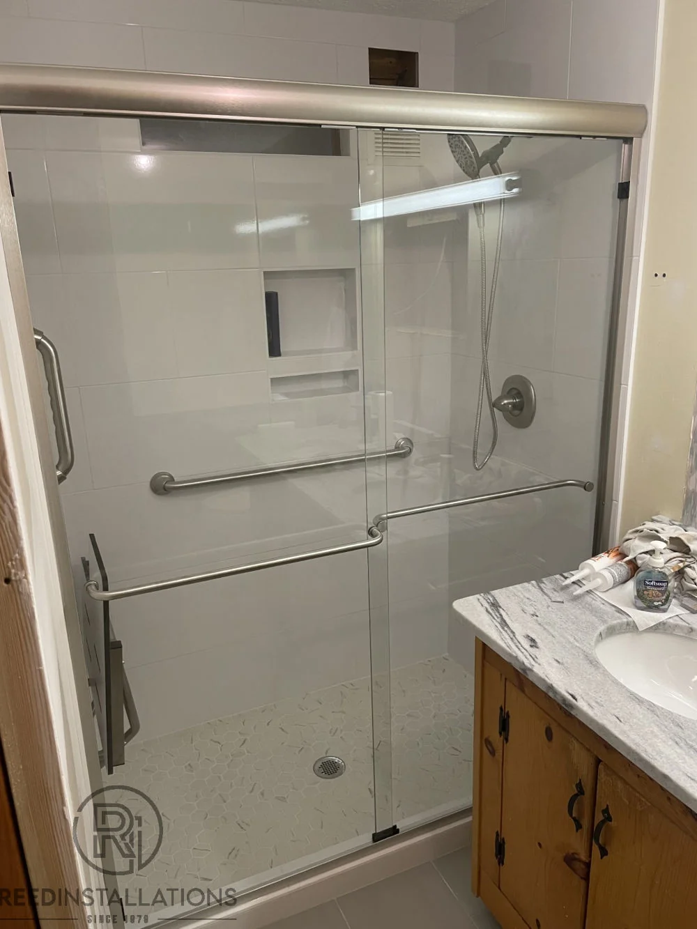 Reed Installations Bespoke Glass, Mirror, and Shower Door Solutions 