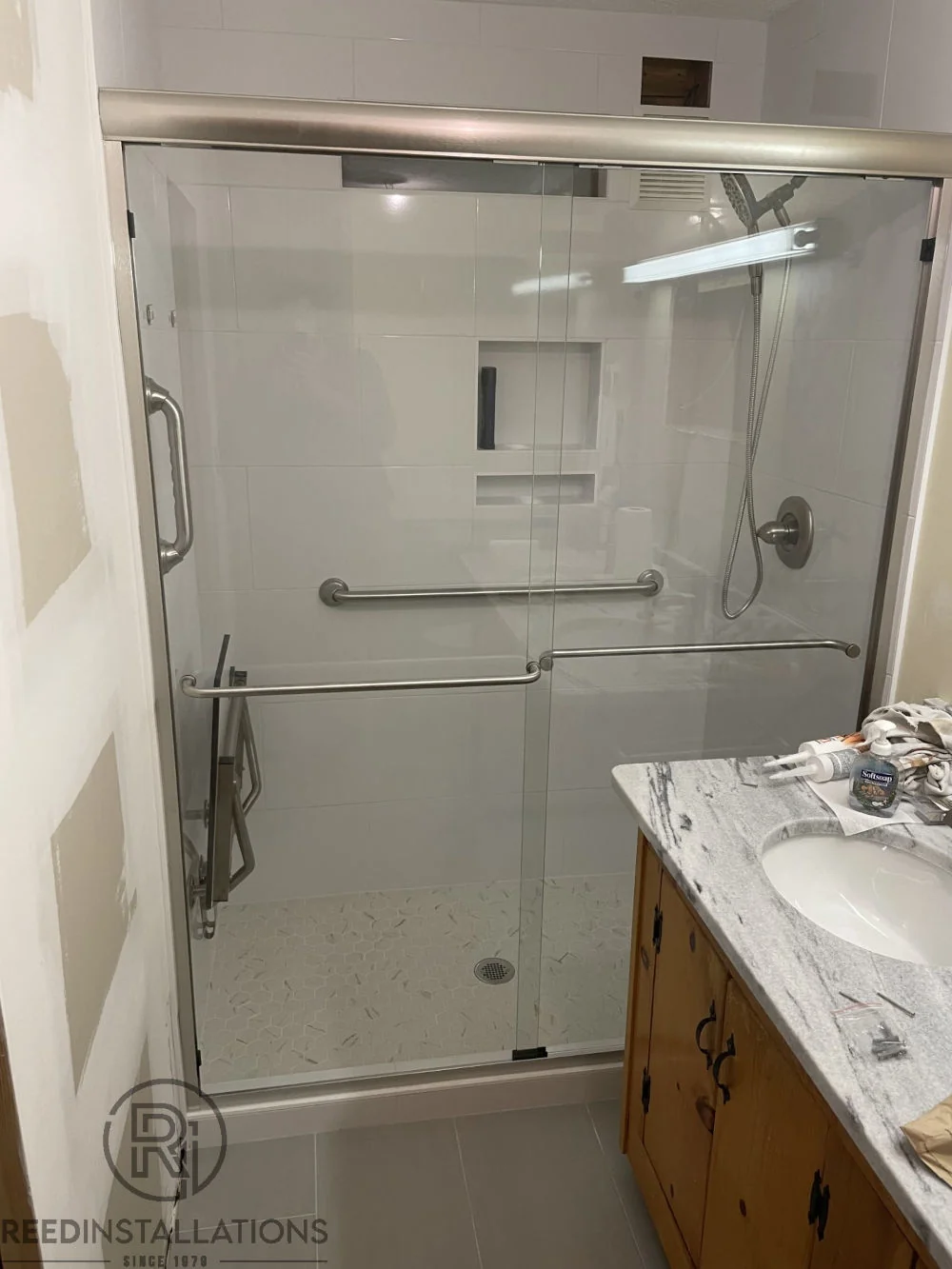 Reed Installations Bespoke Glass, Mirror, and Shower Door Solutions 