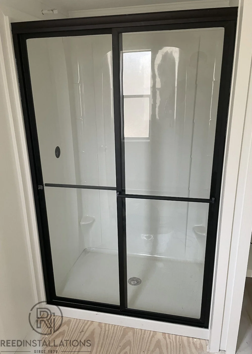 Reed Installations Bespoke Glass, Mirror, and Shower Door Solutions 