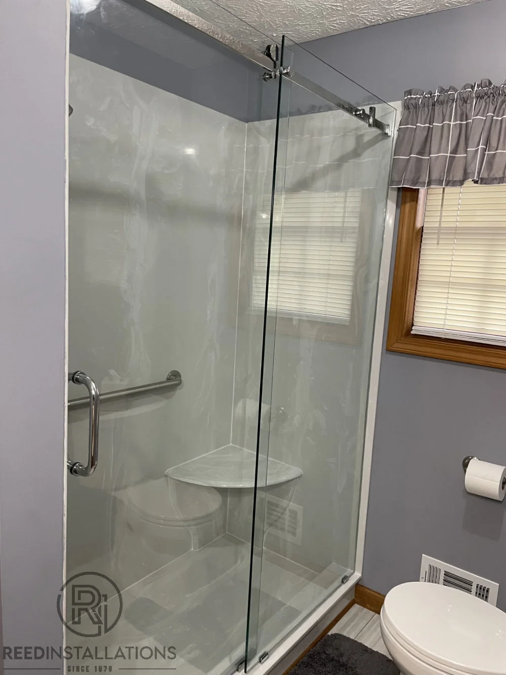 Reed Installations Bespoke Glass, Mirror, and Shower Door Solutions 