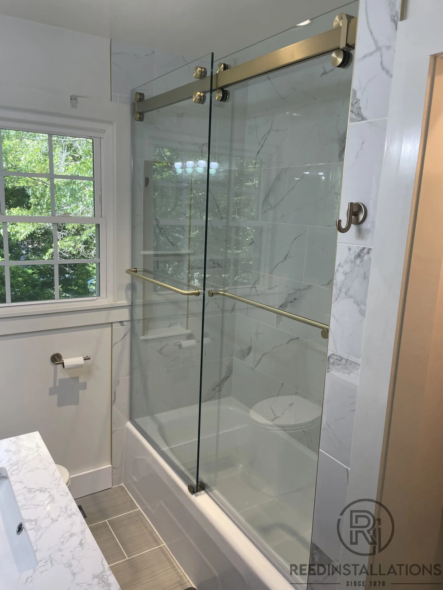 Reed Installations Bespoke Glass, Mirror, and Shower Door Solutions 